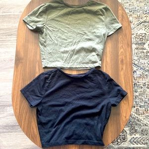 Two Soft, cropped short sleeve shirts.
